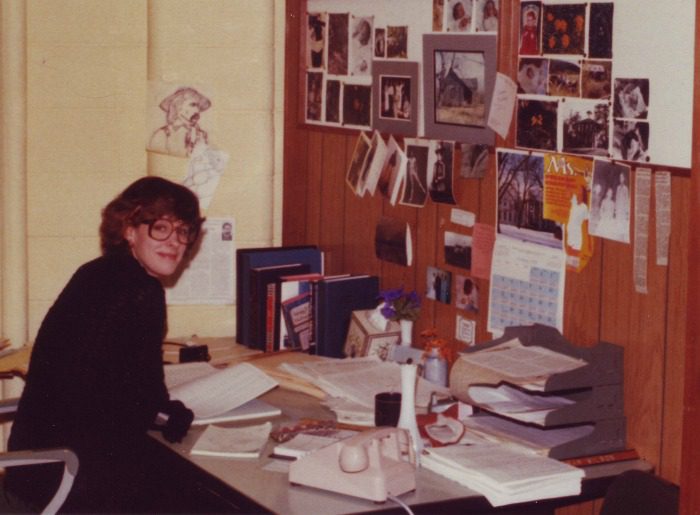 Pamela Smith Hill at work as a public information specialist for the South Dakota Division of Tourism in 1979. She began writing professionally about Laura Ingalls Wilder while working here. There's an image of the Ingalls girls taped to the wall, just to the right of the Ms. magazine cover.