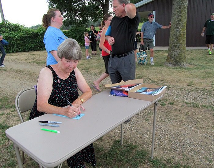 Charlotte Stewart, Miss Beadle from the TV show "Little House on the Prairie," signs autographs at Walnut Grove at LauraPalooza