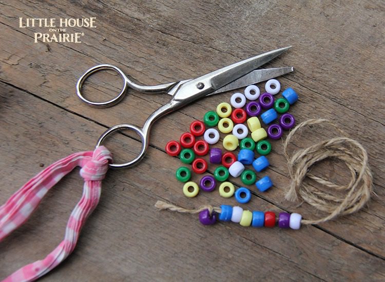 Little House on the Prairie Inspired Craft - stringing beads and buttons hands on activity