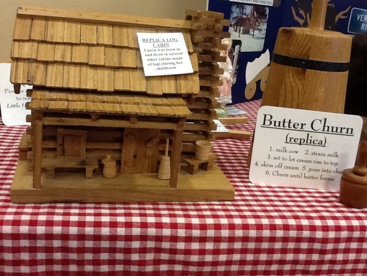 Butter churcn replica and log cabin model