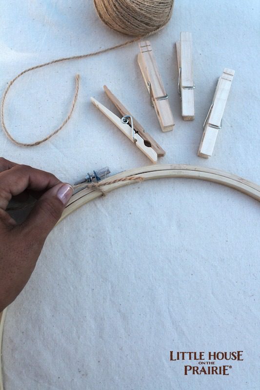 Tie twine to the emroidery hoops for a hoop toss game