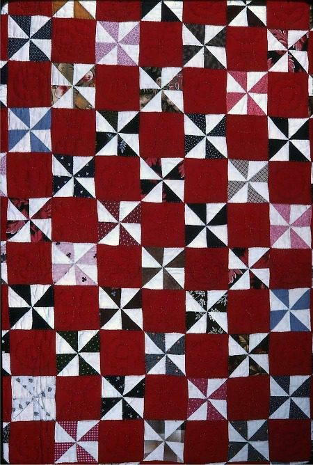Windmill Quilt Block Pattern: Squares are divided into triangles. Triangles are sewn together to make squares. Squares are joined together to make the Windmill Block.