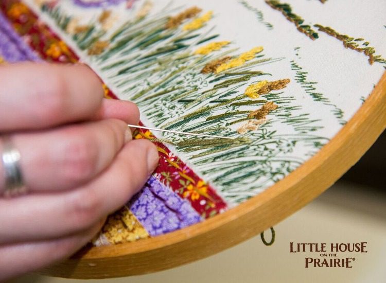 Embroidery details on a Little House on the Prairie inspired hoop project.