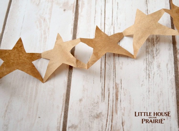 Homemade paper star garlands from the Little House on the Prairie books.