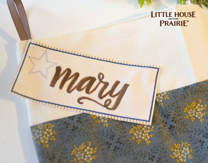Hand lettering the tag for your homemade stocking.